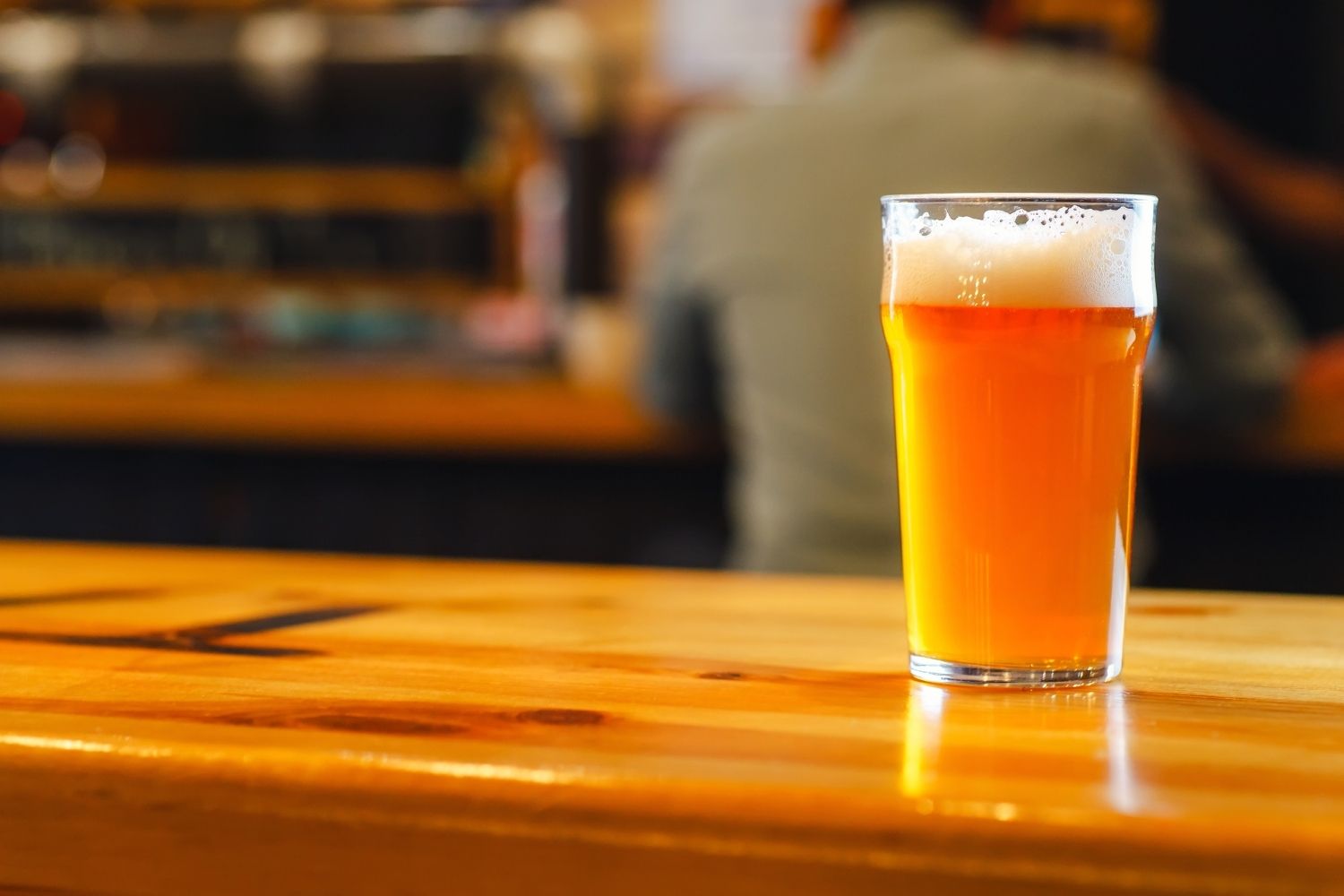 A pint of cask beer on a bar